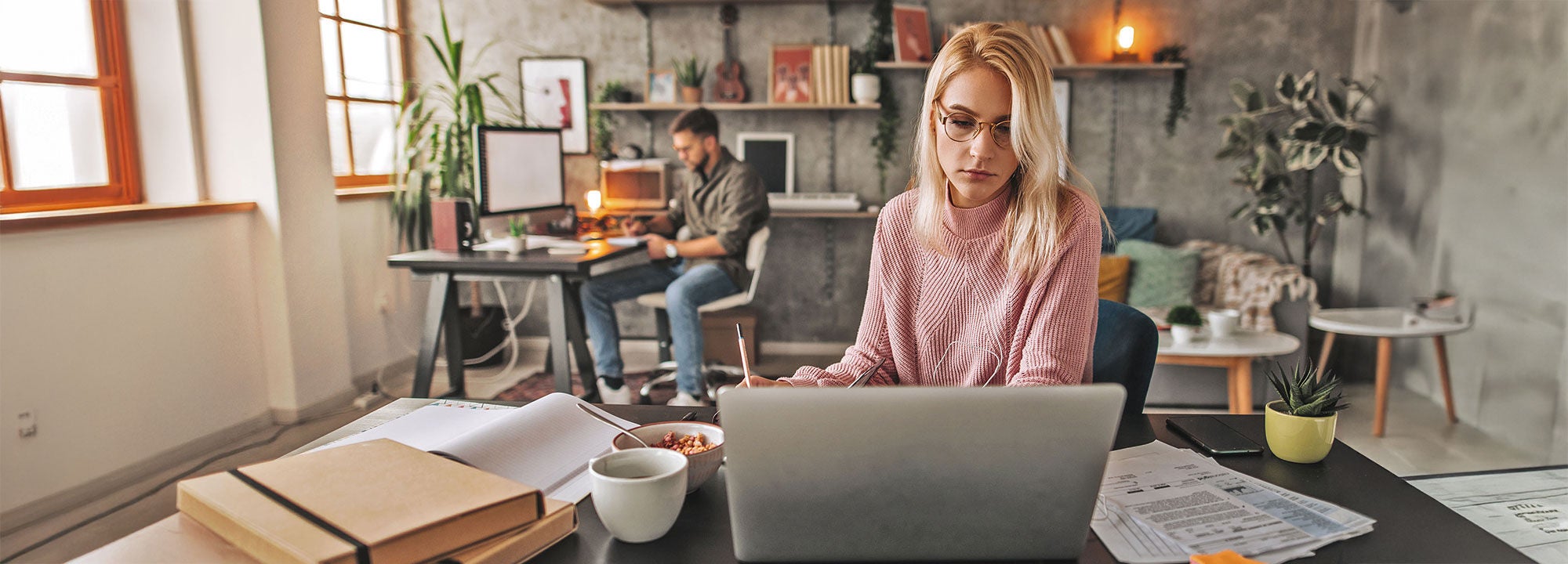 woman working on laptop in an open office